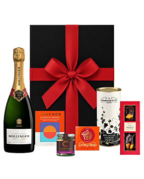 Luxury Bollinger Champagne Christmas hamper with chocolates, festive treats, and ribbon-tied gift box.