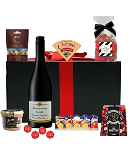 Christmas wine hamper with personalised Cabernet Sauvignon chocolates, savouries and treats. Presented in a black hamper wiht large red ribbon
