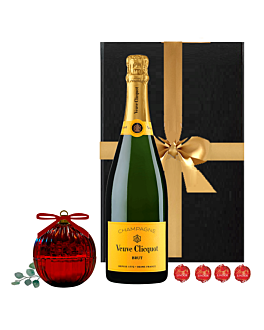 Veuve Clicquot Champagne and red bauble candle in luxury Christmas gift box – Fireside Bauble Gift Set. This gift also includes four luxury Swiss truffles.