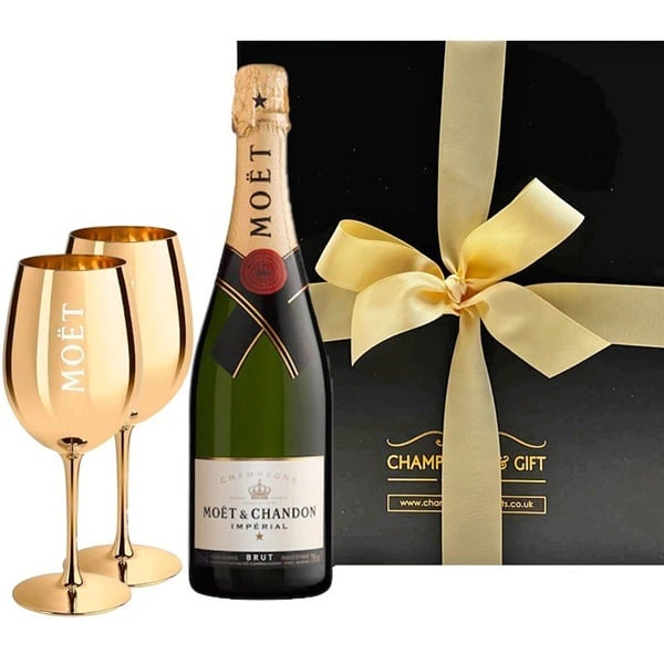 Moet et Chandon Champagne and Flutes Gift Set. Boxed gift with gold Moet crystal flutes and Swiss truffles